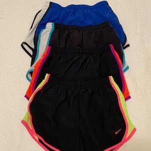 Girls size large nike shorts (4 pack) 3 black, 1 blue